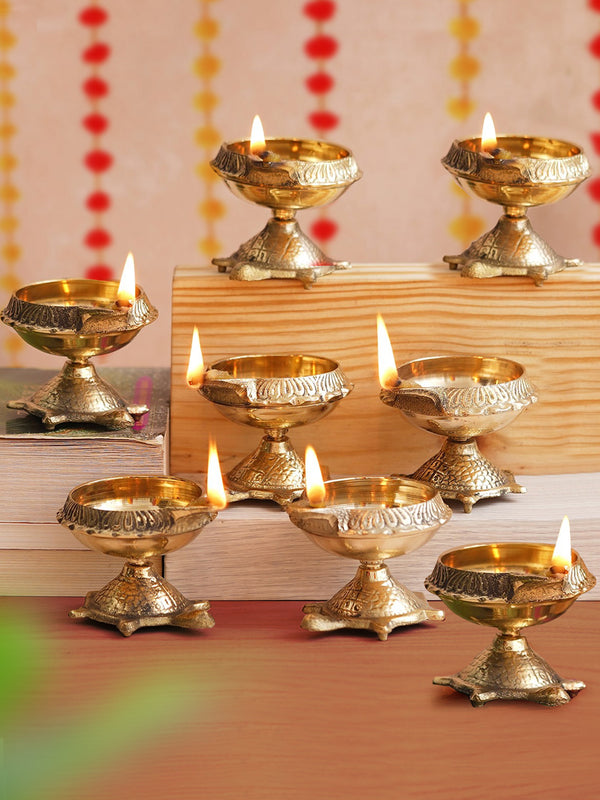 Gold Toned 8 Pieces Decorative Brass Diyas With Tortoise Base